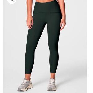 SPANX Booty Boost Leggings on Essex green. Medium.